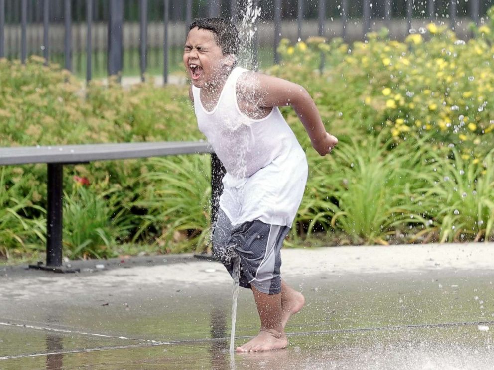 PHOTO: A boy plays in a splash pad in Pittsfield, Mass., July 19, 2019.