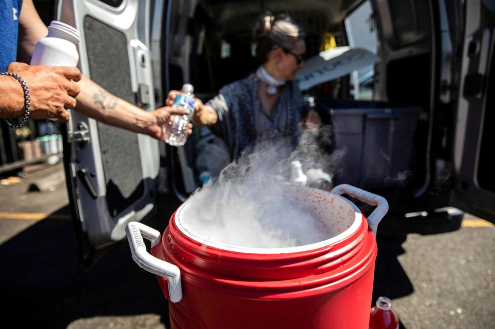 PHOTO: People use dry ice to cool water and Gatorade due to an ice shortage during an unprecedented heat wave in Portland, June 27, 2021. 