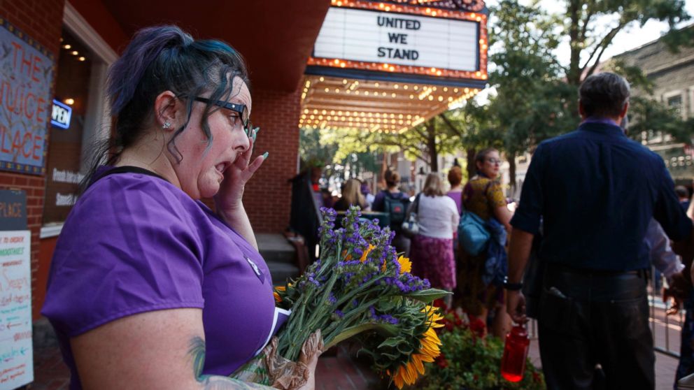 PHOTO: Cynthia Sullivan of Charlottesville, Va., stands in line for a memorial service for Heather Heyer, who was killed during a white nationalist rally, Aug. 16, 2017, in Charlottesville, Va.