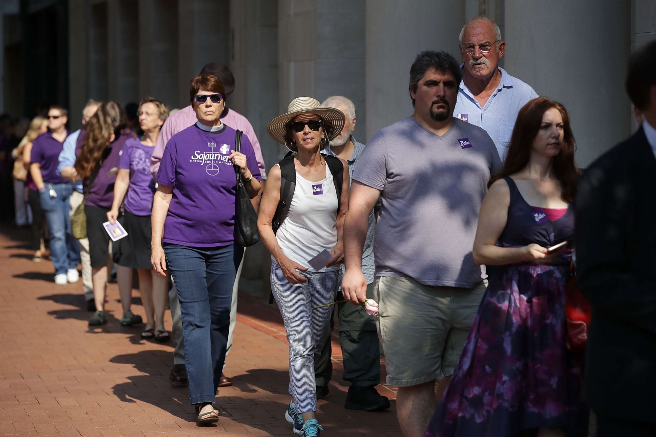 PHOTO: People line up to attend the memorial service for Heather Heyer, who was killed when a car slammed into a crowd of people protesting against a white supremacist rally, Aug. 16, 2017, in Charlottesville, Va.
