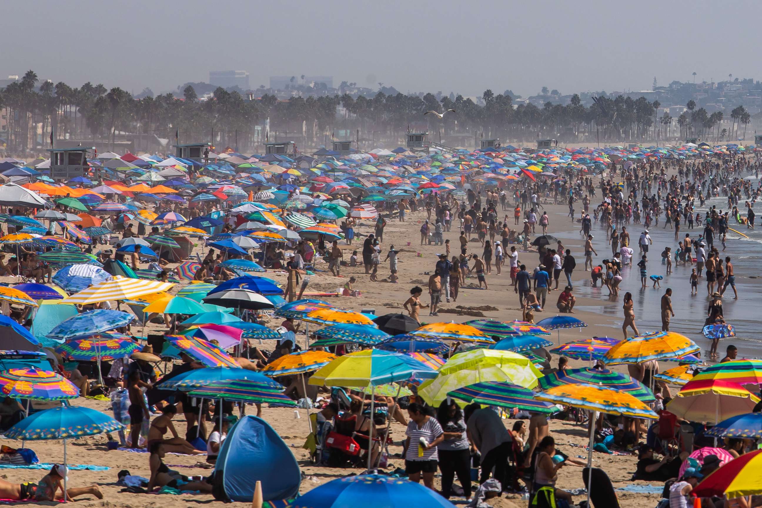 PHOTO: People gather on the beach on the second day of the Labor Day weekend amid a heatwave in Santa Monica, Caif., Sept, 6, 2020.