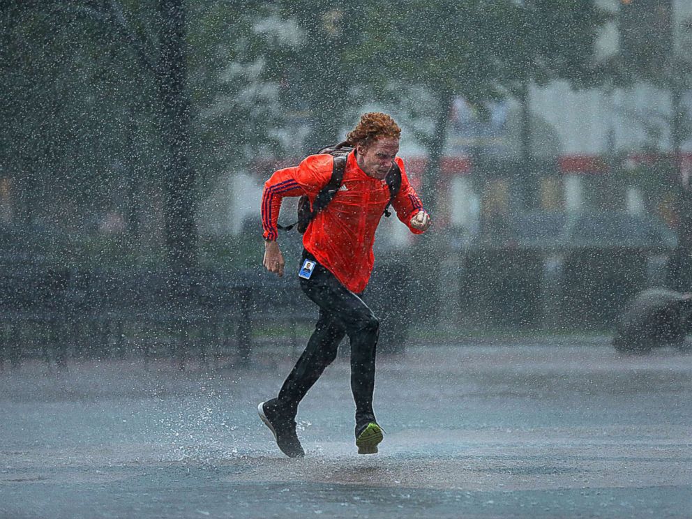 PHOTO: A pedestrian crosses the driving rain on Bostons Copley Square on September 18, 2018.