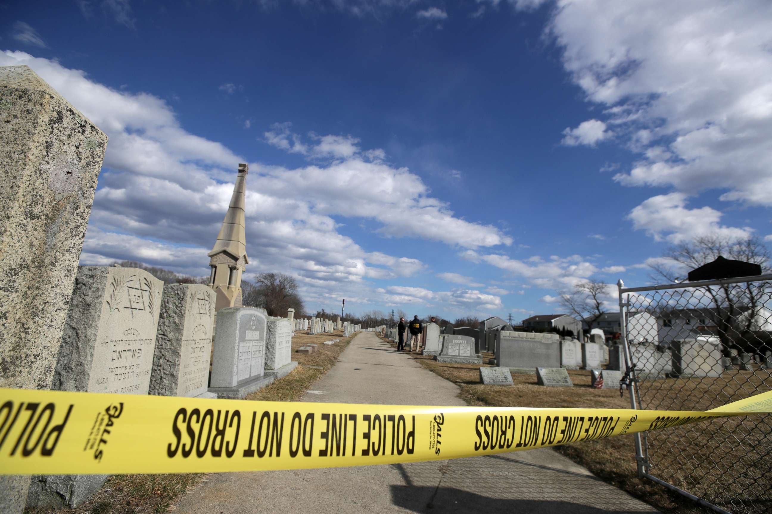 PHOTO: Police tape hangs in front of gravestones at the Hebrew Cemetery in Fall River, Mass., where markers were vandalized, March 19, 2019.