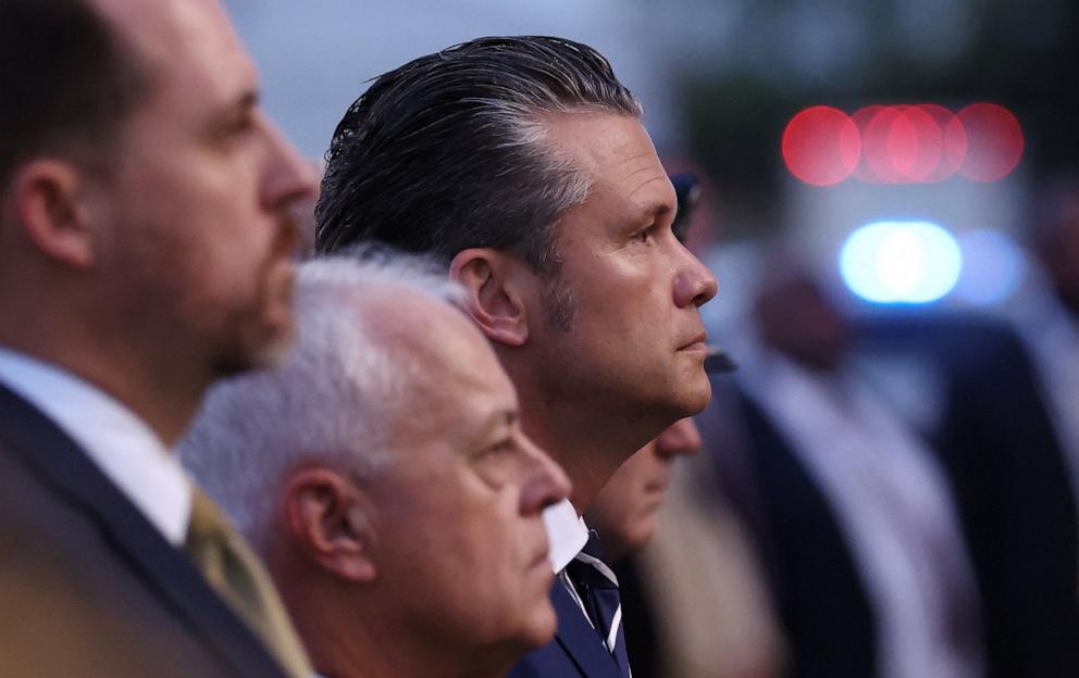 PHOTO: Secretary of Defense Pete Hegseth listens to proceedings before the unfurling of the U.S. flag from the roof of the Pentagon during a ceremony marking the 24th anniversary of the 9/11 attacks on the United States, in Washington, September 11, 2025.