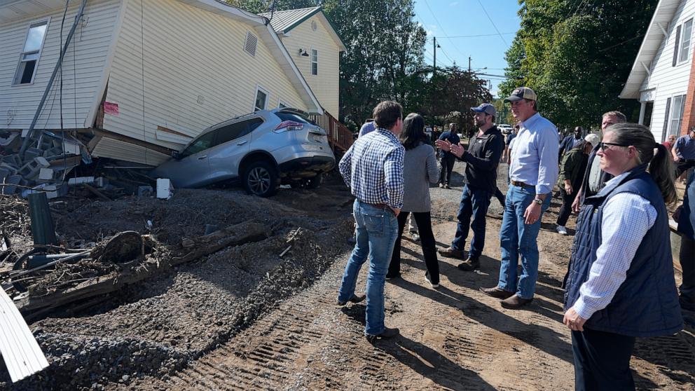 PHOTO: Republican vice presidential nominee Sen. JD Vance, gestures as he talks with residents during as he visits areas impacted by Hurricane Helene in Damascus, Va., Oct. 3, 2024.