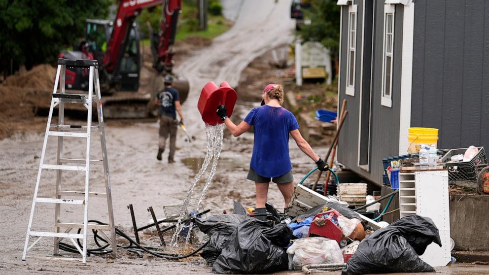 PHOTO: People clean up in the aftermath of Hurricane Helene, Oct. 1, 2024, in Hot Springs, N.C.