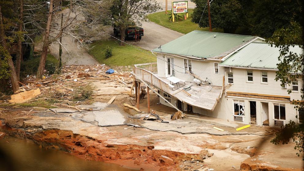 PHOTO: Debris sits near a damaged building near the Broad River after floodwaters sent a violent torrent through the town during Tropical Storm Helene, in Chimney Rock, N.C., Oct. 1, 2024.