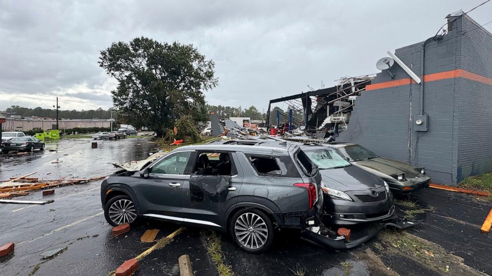 PHOTO: Debris and smashed vehicles are scattered across a parking lot near Hing Ta Restaurant after a tornado hit Rocky Mount, N.C., Sept. 27, 2024. 