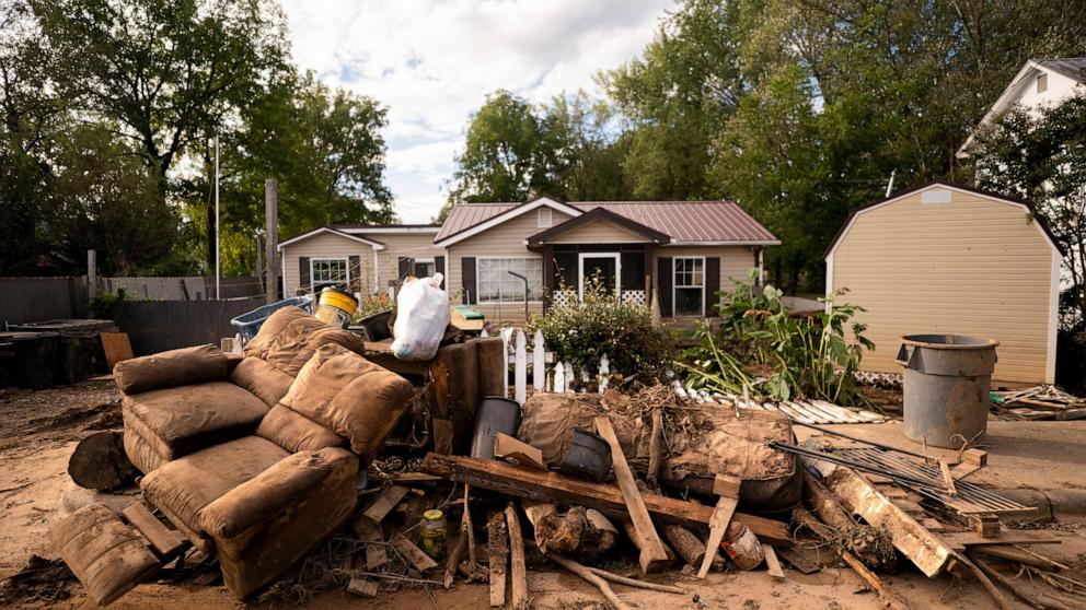 PHOTO: Storm damaged belongings sit along the road in the aftermath of Hurricane Helene on Sept. 30, 2024 in Old Fort, N.C.