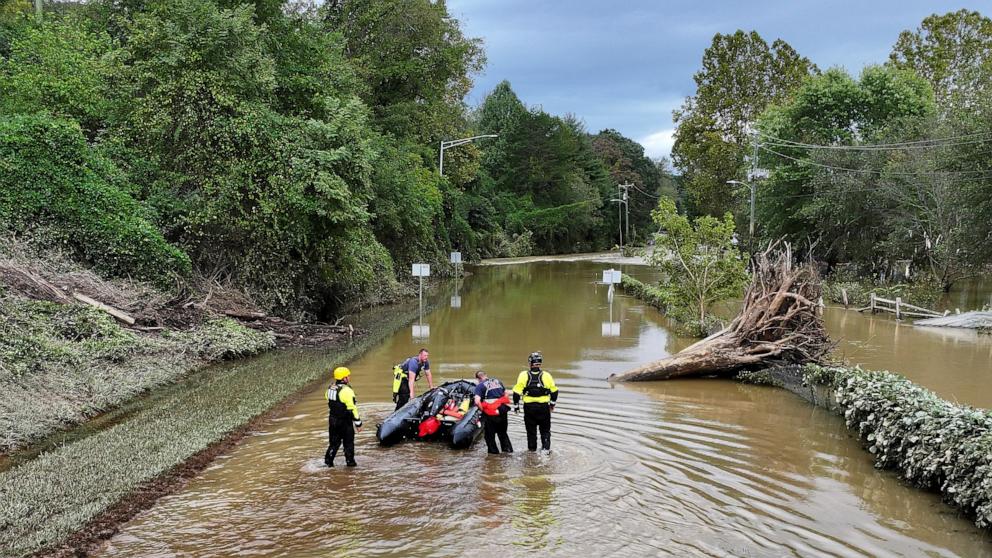 PHOTO: A drone view shows rescue personnel working in a flooded area, following the pass of Hurricane Helene, in Asheville, N.C., Sept. 29, 2024. 