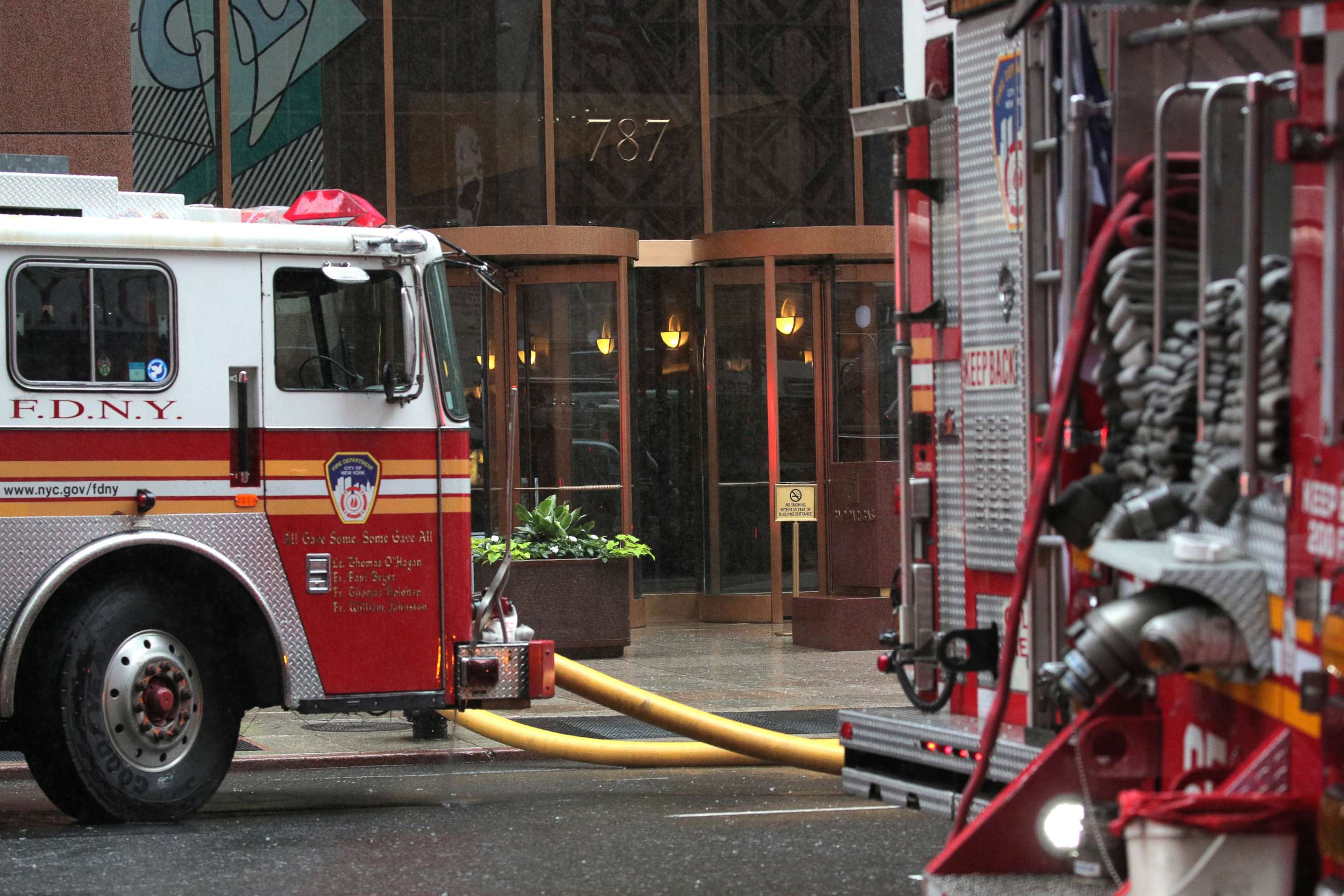 PHOTO: New York City Fire Department trucks are seen outside 787 7th Avenue in midtown where a helicopter was reported to have crashed, June 10, 2019. 