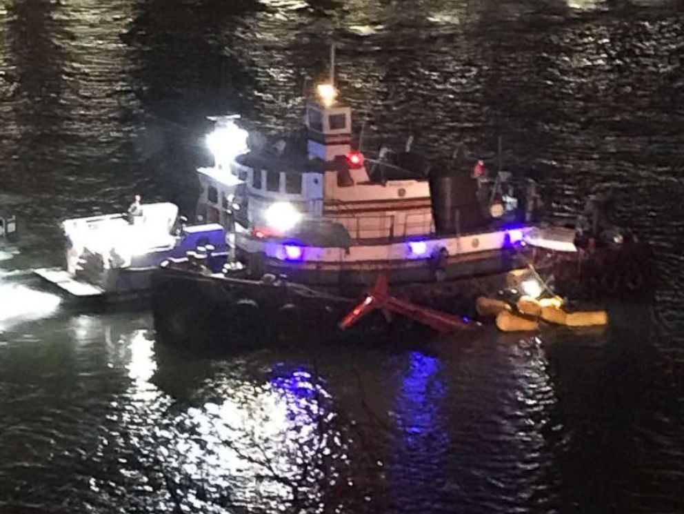 PHOTO: A boat on the scene where a helicopter crashed into the East River in New York City, March 11, 2018. 
