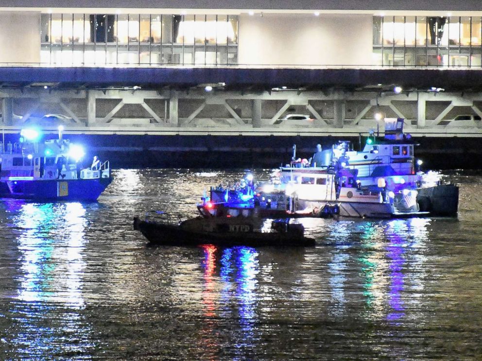 PHOTO: Emergency responders work at the scene of a helicopter crash in the East River, March 11, 2018 in New York City. According to reports at least two people were killed.