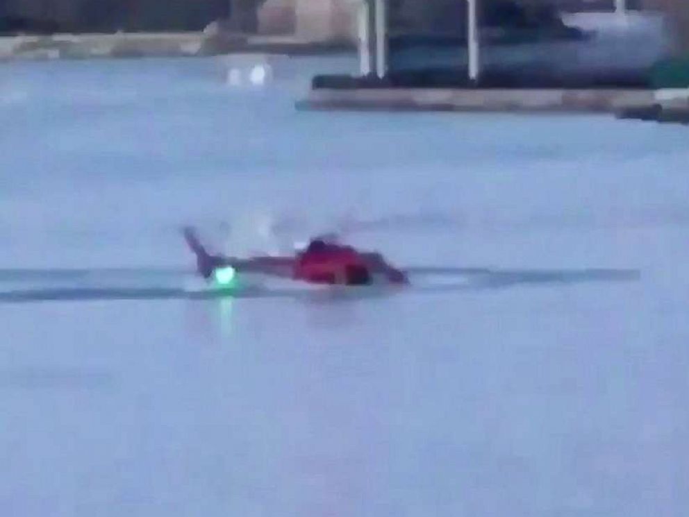 PHOTO: A helicopter crashed in New York Citys East River, March 11, 2018, in a still image from video posted to Twitter.