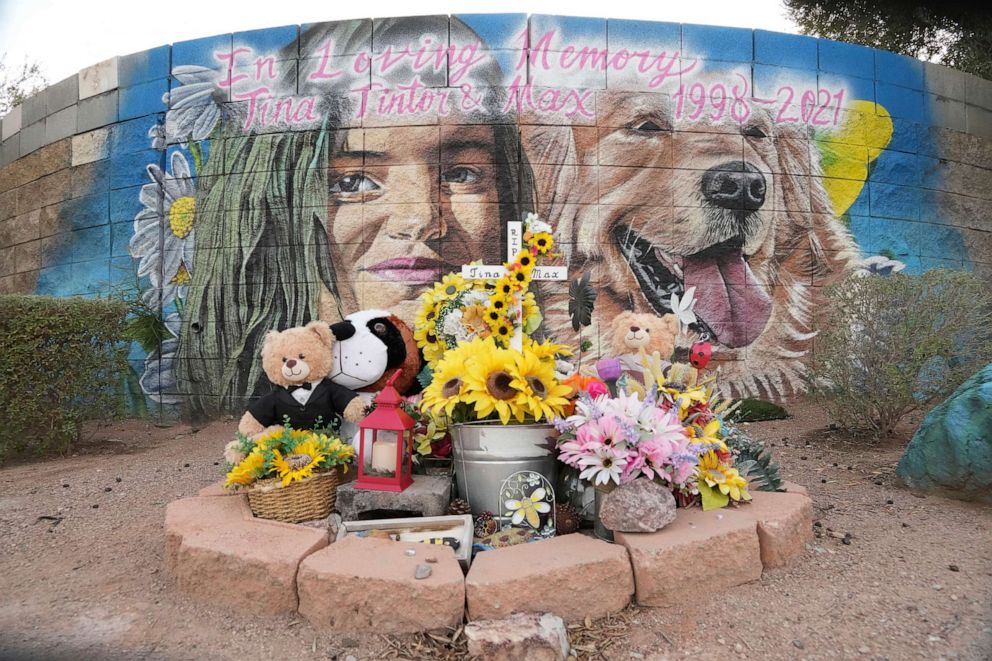PHOTO: In this Nov. 2, 2021, file photo, a memorial for Tina Tintor, 23, and her golden retriever pet dog, is shown in Las Vegas near the scene of a fatal crash involving former Las Vegas Raiders receiver Henry Ruggs III.