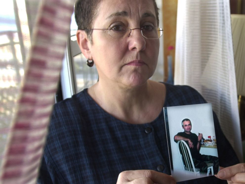 PHOTO: Lucyna Siwiak holds a photo of her brother Henryk Siwiak, at home in New York, Jan. 18, 2002.