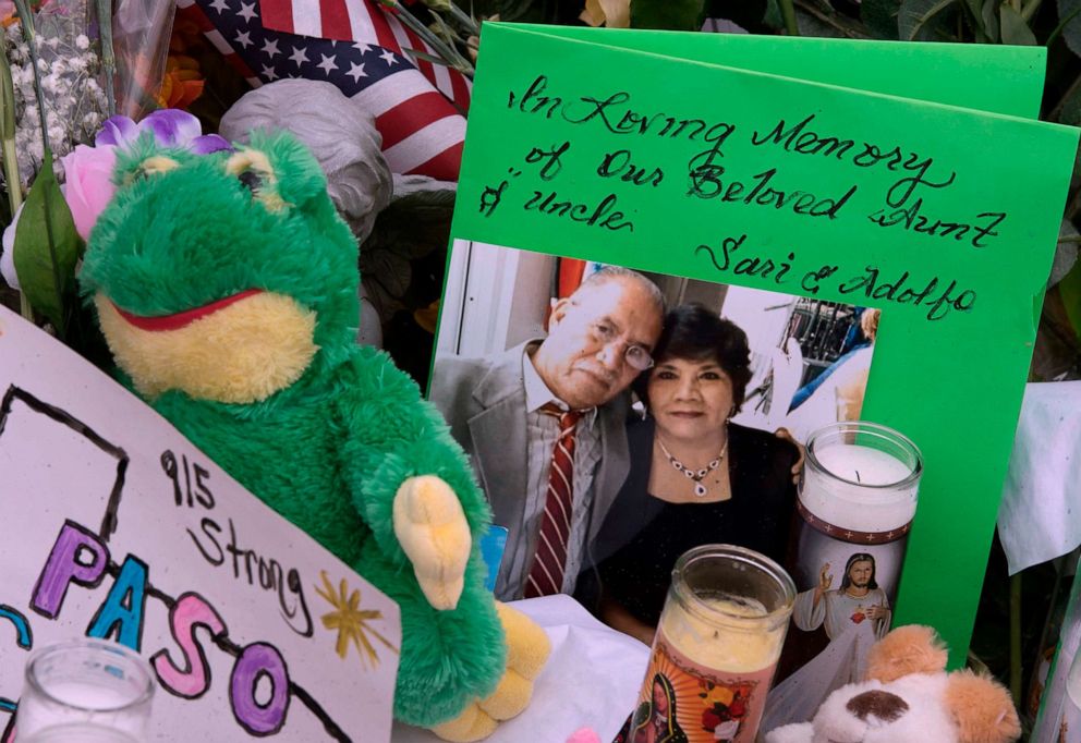 PHOTO: A photo of victims Adolfo Hernandez and Sari Regalado adorn a makeshift memorial for victims at the Cielo Vista Mall Walmart in El Paso, Texas, Aug. 6, 2019.