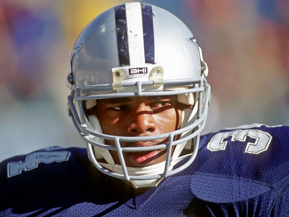 PHOTO: Running back Herschel Walker #34 of the Dallas Cowboys looks on from the sideline during a game against the Cleveland Browns at Cleveland Municipal Stadium on December 4, 1988 in Cleveland, Ohio.