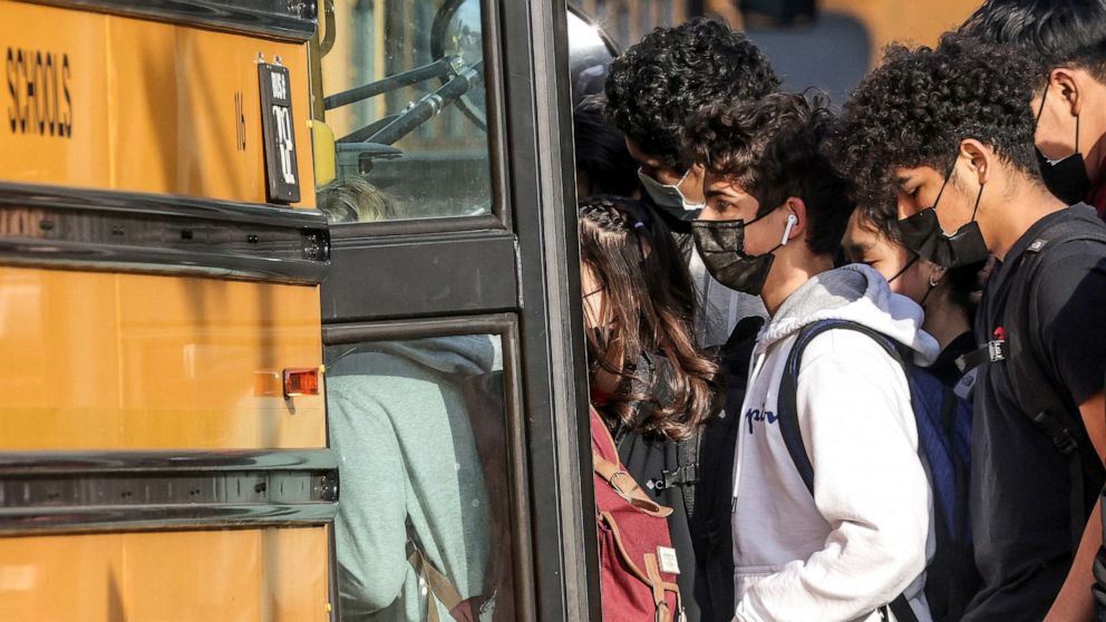 PHOTO: Students board a school bus outside of Washington-Liberty High School in Arlington County, Va., Jan. 25, 2022.