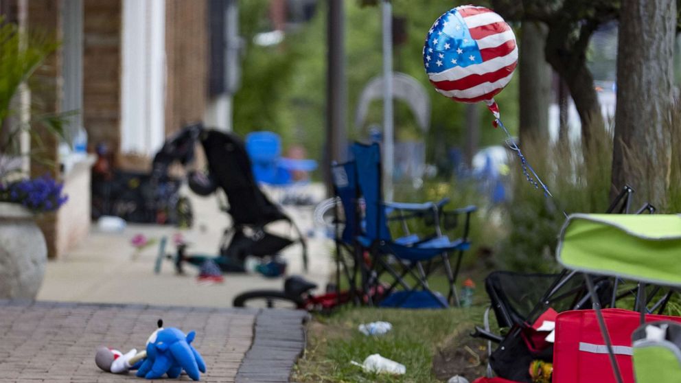 PHOTO: Chairs, bicycles, strollers and balloons were left behind at the scene of a mass shooting on the Fourth of July parade route along Central Avenue in Highland Park, Ill., July 4, 2022. 