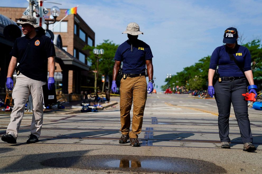 PHOTO: FBI agents investigate after a mass shooting at a Fourth of July parade in the Chicago suburb of Highland Park, Ill., July 5, 2022.