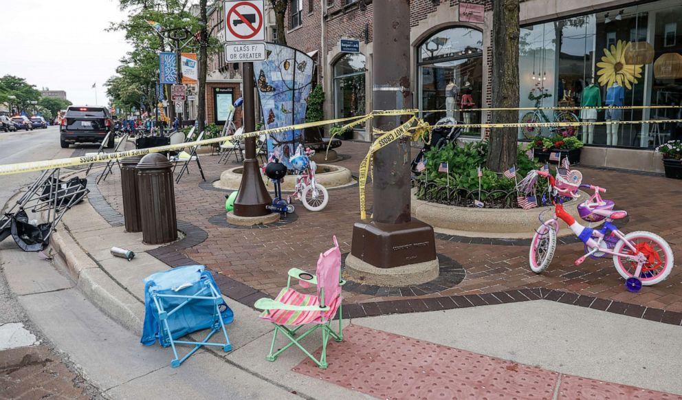 PHOTO: hairs and bicycles lie abandoned after people fled the scene of a deadly mass shooting at a 4th of July celebration and parade in Highland Park, Ill., July 4, 2022.