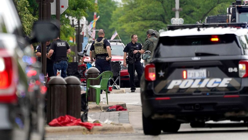 PHOTO: Law enforcement search in a building after a mass shooting at the Highland Park Fourth of July parade in downtown Highland Park, a Chicago suburb on Monday, July 4, 2022.