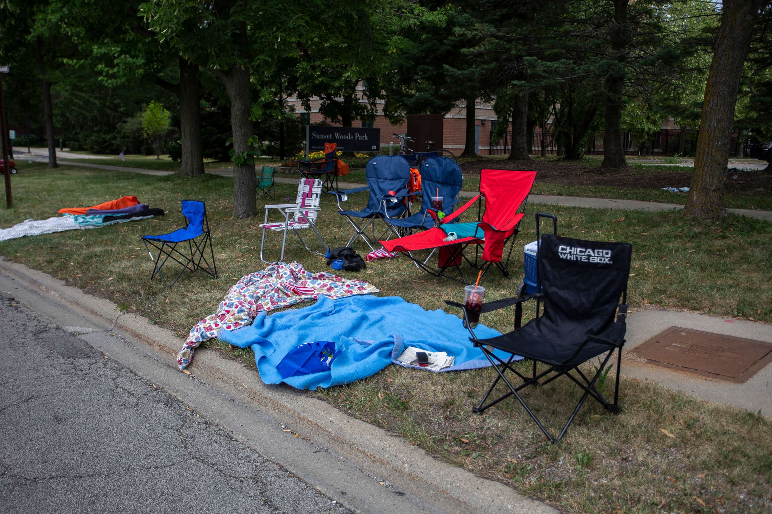 PHOTO: Chairs and blankets sit abandoned after a shooting at a Fourth of July parade on July 4, 2022 in Highland Park, Illinois. At least six people were killed, according to authorities.