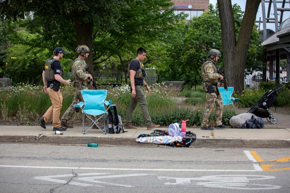 PHOTO: In this July 4, 2022, file photo, law enforcement works the scene after a mass shooting at a Fourth of July parade in Highland Park, Ill.