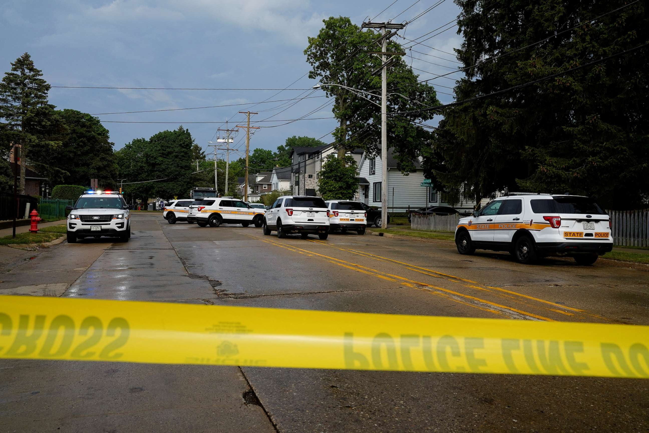 PHOTO: Police investigate outside the home of the mother of the man detained after a mass shooting at a Fourth of July parade route in the Chicago suburb of Highland Park, Ill., on July 4, 2022.