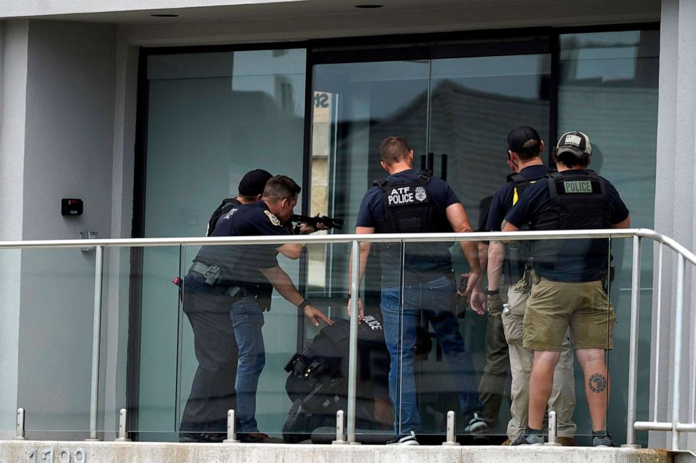 PHOTO: Law enforcement search in a building after a mass shooting at the Highland Park Fourth of July parade in downtown Highland Park, a Chicago suburb on Monday, July 4, 2022.