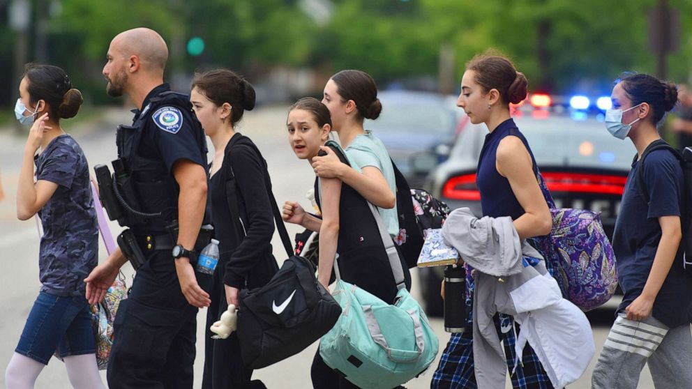 PHOTO: People are escorted away from the scene of a mass shooting at a Fourth of July parade in Highland Park, Ill., on July 4, 2022. 