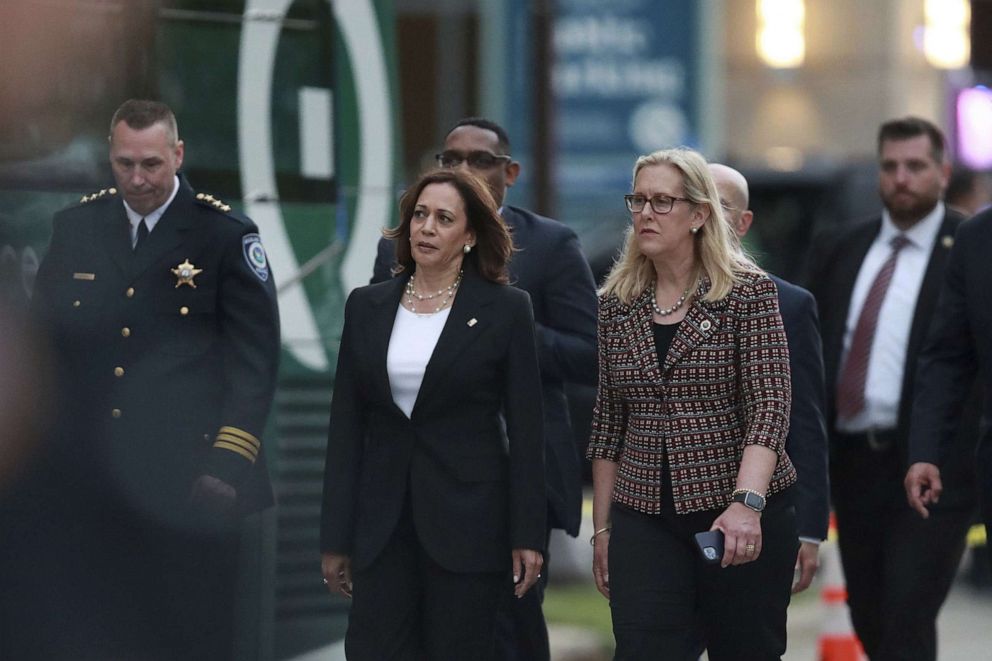 PHOTO: Vice president Kamala Harris, left, walks with Highland Park, Ill., mayor Nancy Rotering as Harris arrives to visit the site of the mass shooting at the Highland Park July 4th parade, in Highland Park, Ill, July 5, 2022.