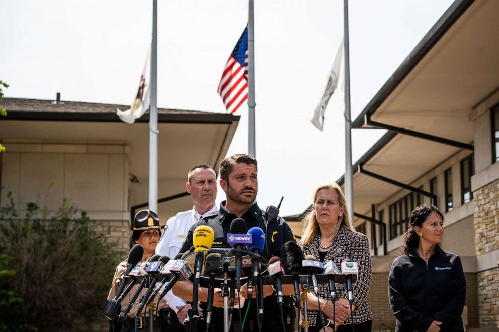 PHOTO: Police Chief Louis Jogmen and Mayor Nancy Rotering look on while Deputy Chief Christopher Covelli speaks to the media during a news conference outside the  Police Department in Highland Park, Ill., July 5, 2022.