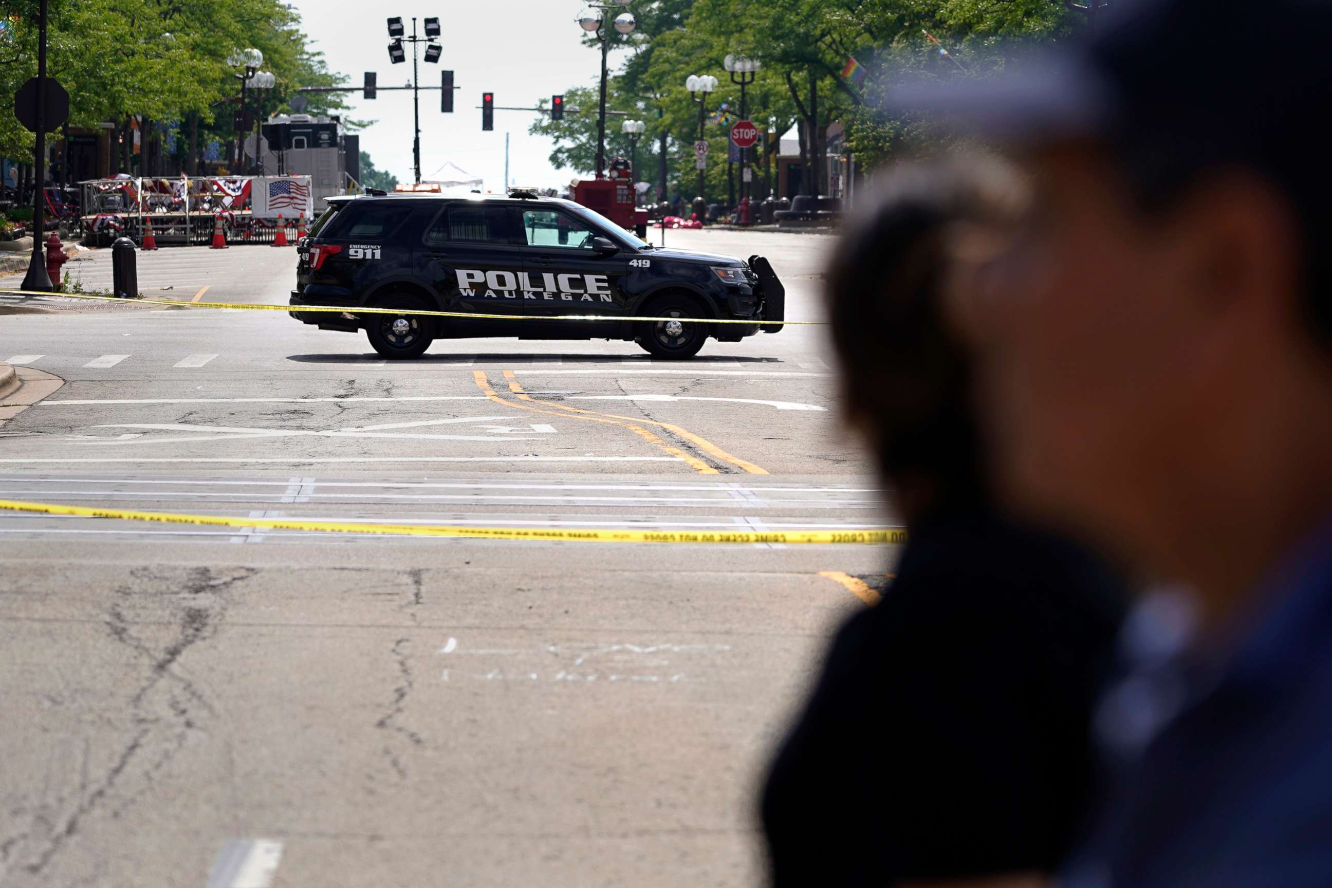 PHOTO: A police vehicle blocks the road on Central avenue where multiple people were killed during Fourth of July celebrations, July 7, 2022, in Highland Park, Ill.