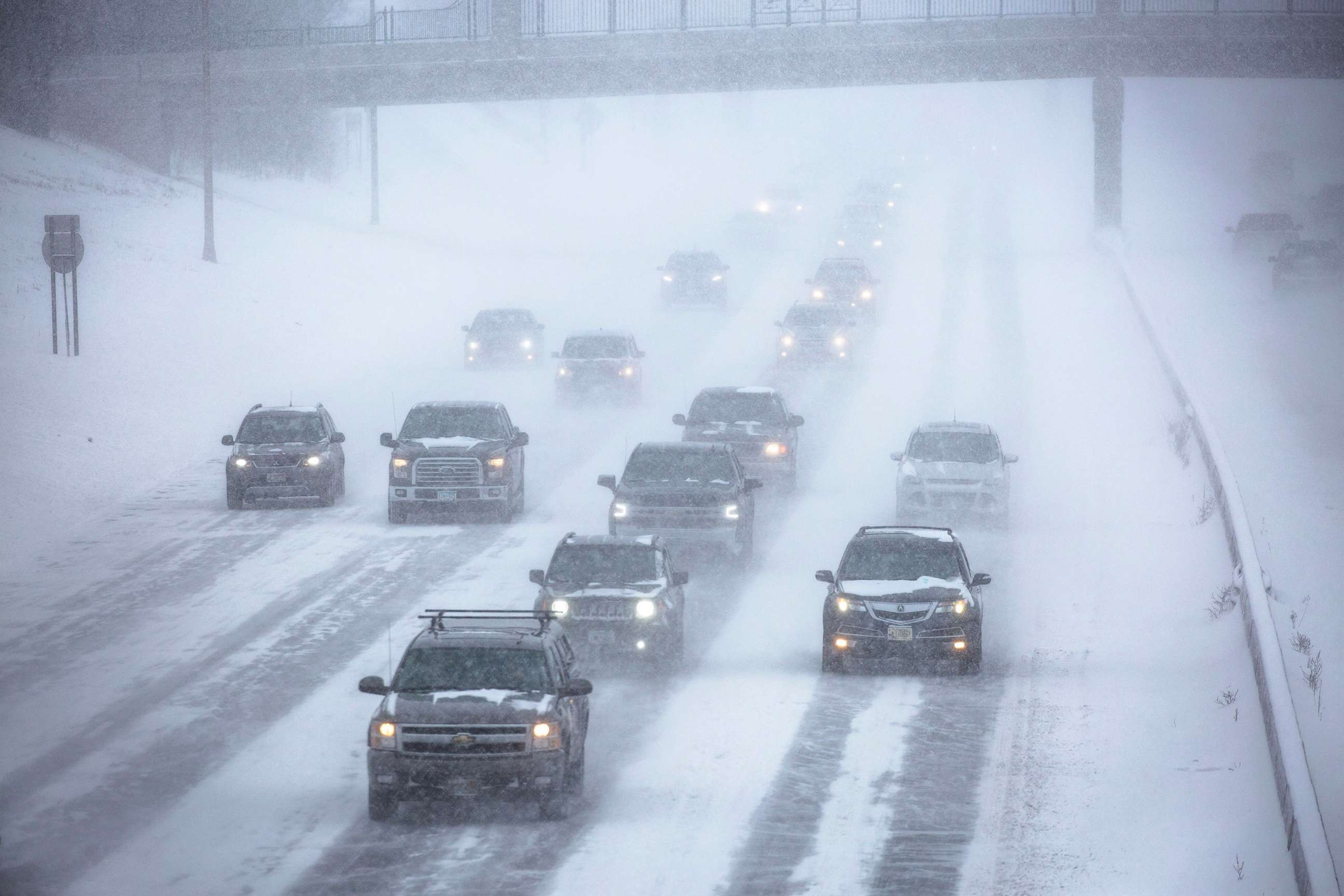PHOTO: Vehicles are seen during a heavy snowstorm on a highway in St. Paul, Minnesota, Feb. 22, 2022.