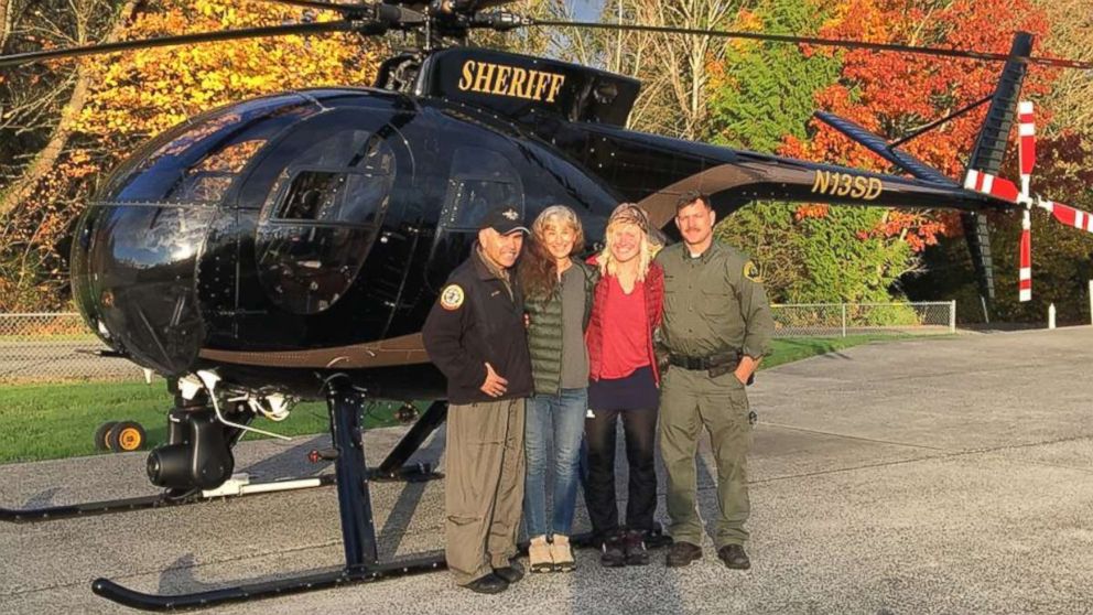 Chief pilot Bill Quistorf, Nancy Abell, Katharina Groene and pilot Einar Espeland pose for a photo after the Snohomish County Sheriff's Office search and rescue team found Groene lost on the Pacific Coast Trail after a call from Abell on Oct. 29, 2018. 