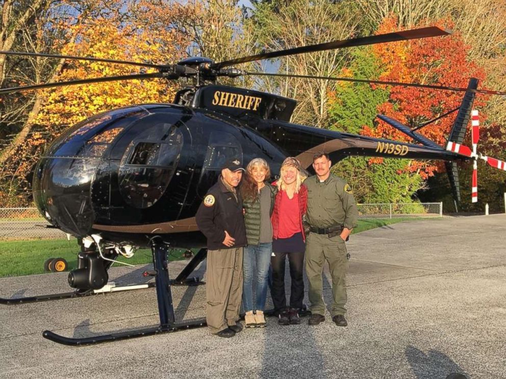 Chief pilot Bill Quistorf, Nancy Abell, Katharina Groene and pilot Einar Espeland pose for a photo after the Snohomish County Sheriff's Office search and rescue team found Groene lost on the Pacific Coast Trail after a call from Abell on Oct. 29, 2018. 