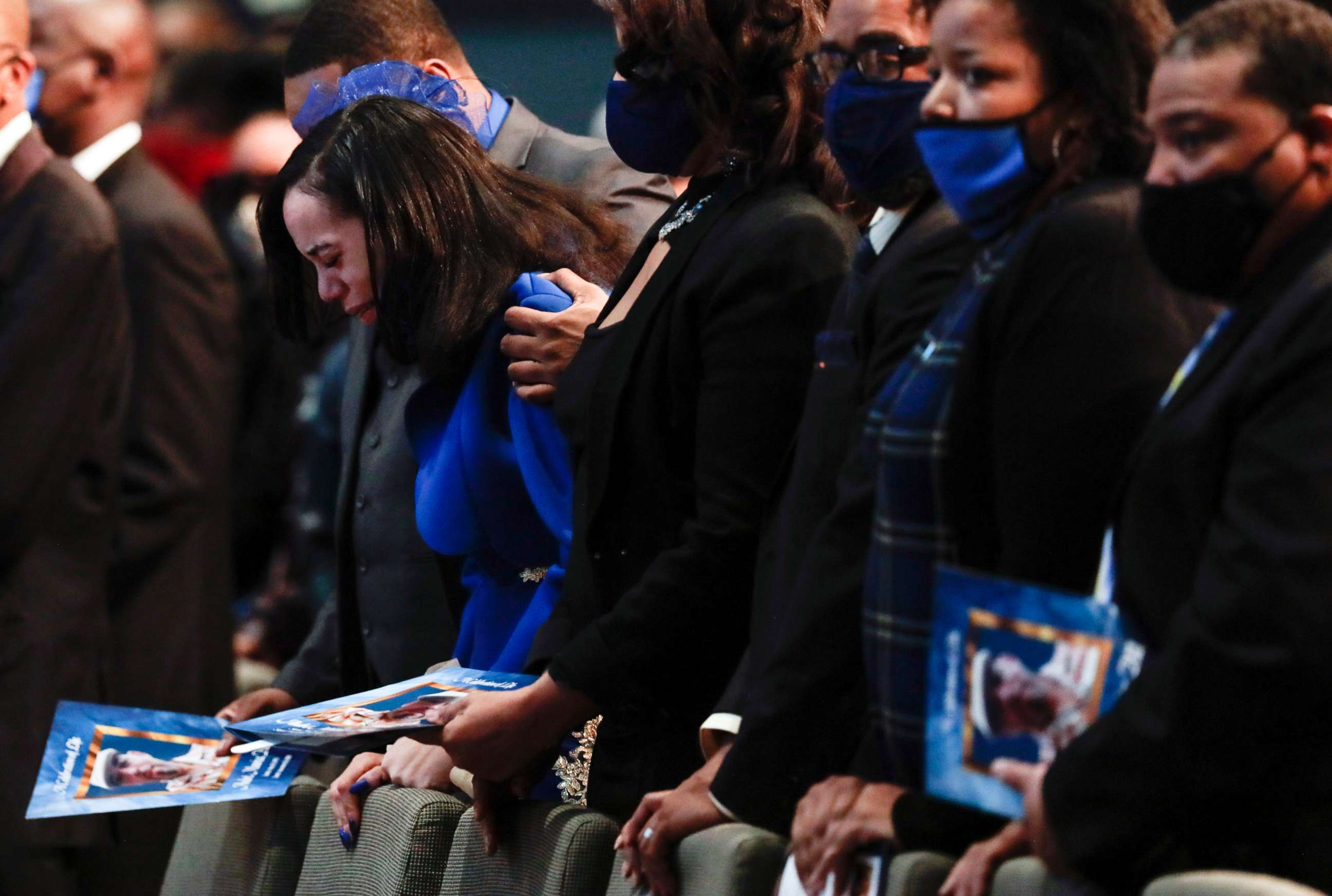 PHOTO: Karissa Hill, daughter of Andre Hill, is comforted by family as she weeps while her father's casket is closed at the start of his funeral service, Jan. 5, 2021, at First Church of God, in Columbus, Ohio.