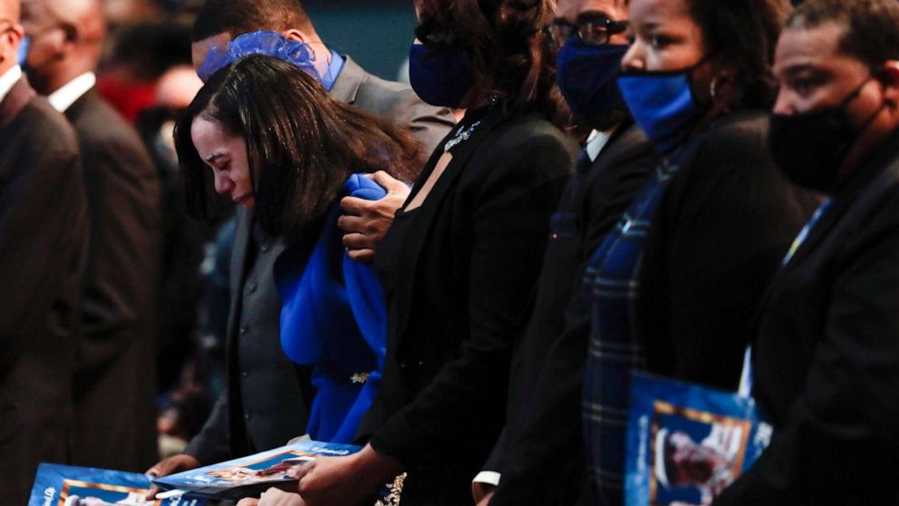 PHOTO: Karissa Hill, daughter of Andre Hill, is comforted by family as she weeps while her father's casket is closed at the start of his funeral service, Jan. 5, 2021, at First Church of God, in Columbus, Ohio.