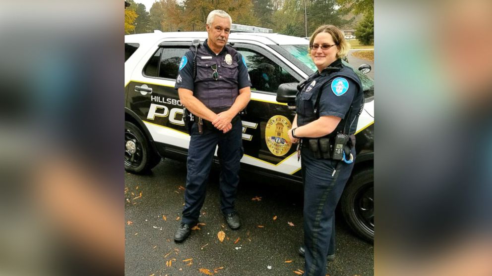 Senior Corporal Keith Bradshaw and Officer First Class Candace Spragins delivered groceries to a mother after she was charged with misdemeanor larceny at a Food Lion store in Hillsborough, North Carolina.