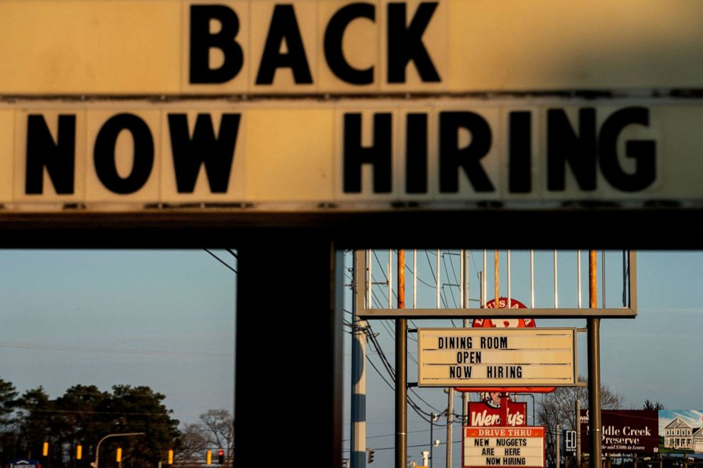 PHOTO: Now Hiring signs are displayed in front of restaurants in Rehoboth Beach, Delaware, on March 19, 2022.