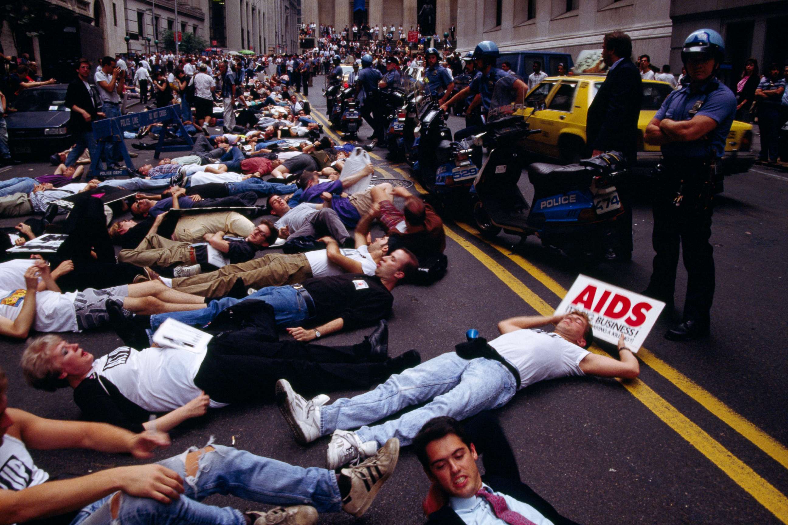 PHOTO: Demonstrators gather in front of the Federal Hall National Memorial in Wall Street in protest of the rising prices of AIDS medication AZT.