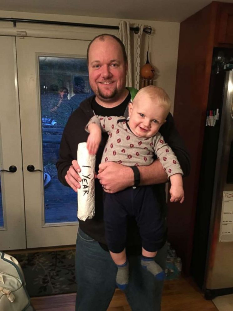 Brad Williams with his son, and a cheesesteak, at 1 year old.