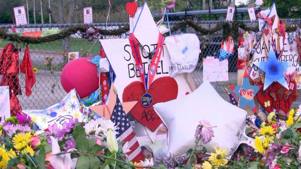 PHOTO: The Marjory Stoneman Douglas High School Eagles hockey team state championship medals are seen decorating memorials dedicated to victims of the mass shooting in Parkland, Fla., Feb. 26, 2018.