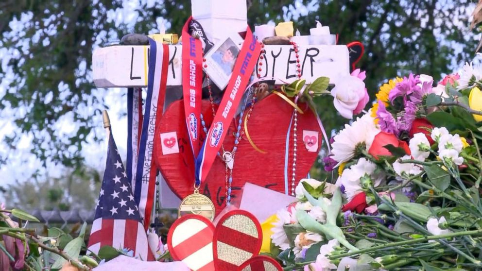 PHOTO: The Marjory Stoneman Douglas High School Eagles hockey team state championship medals are seen decorating memorials dedicated to victims of the mass shooting in Parkland, Fla., Feb. 26, 2018.