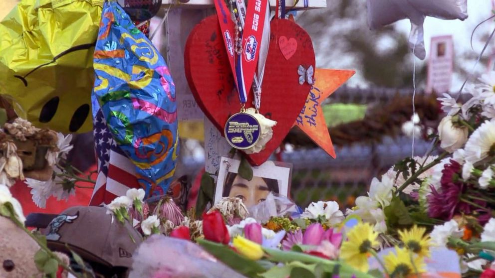 PHOTO: The Marjory Stoneman Douglas High School Eagles hockey team state championship medals are seen decorating memorials dedicated to victims of the mass shooting in Parkland, Fla., Feb. 26, 2018.