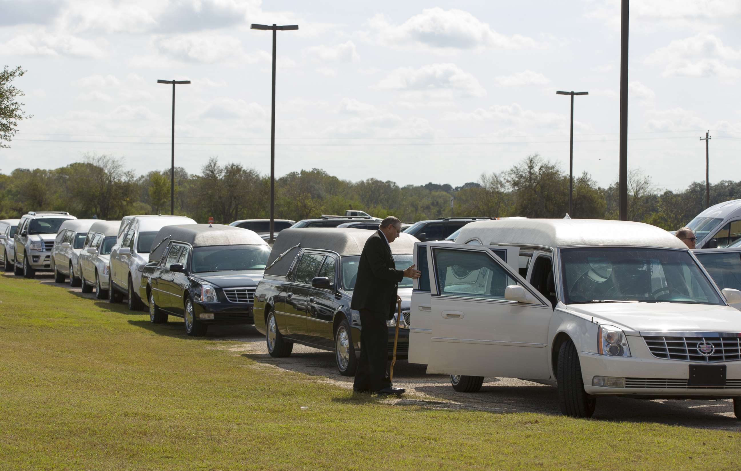 PHOTO: Hearses line up for the memorial service held at the Floresville Events Center on November 15, 2017 in Floresville, Texas for the nine members of the Holcombe family killed in the Sutherland Springs church shooting.