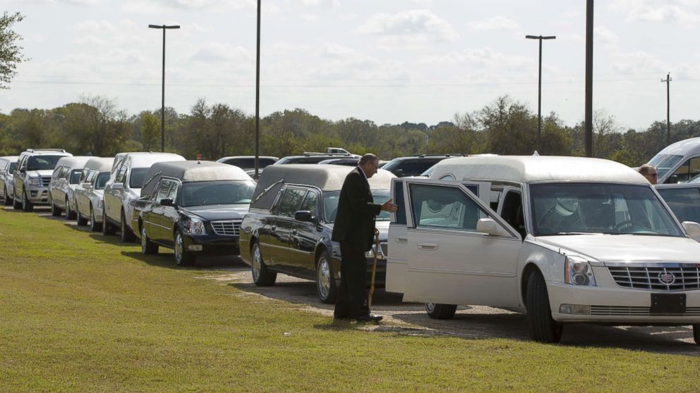 PHOTO: Hearses line up for the memorial service held at the Floresville Events Center on November 15, 2017 in Floresville, Texas for the nine members of the Holcombe family killed in the Sutherland Springs church shooting.