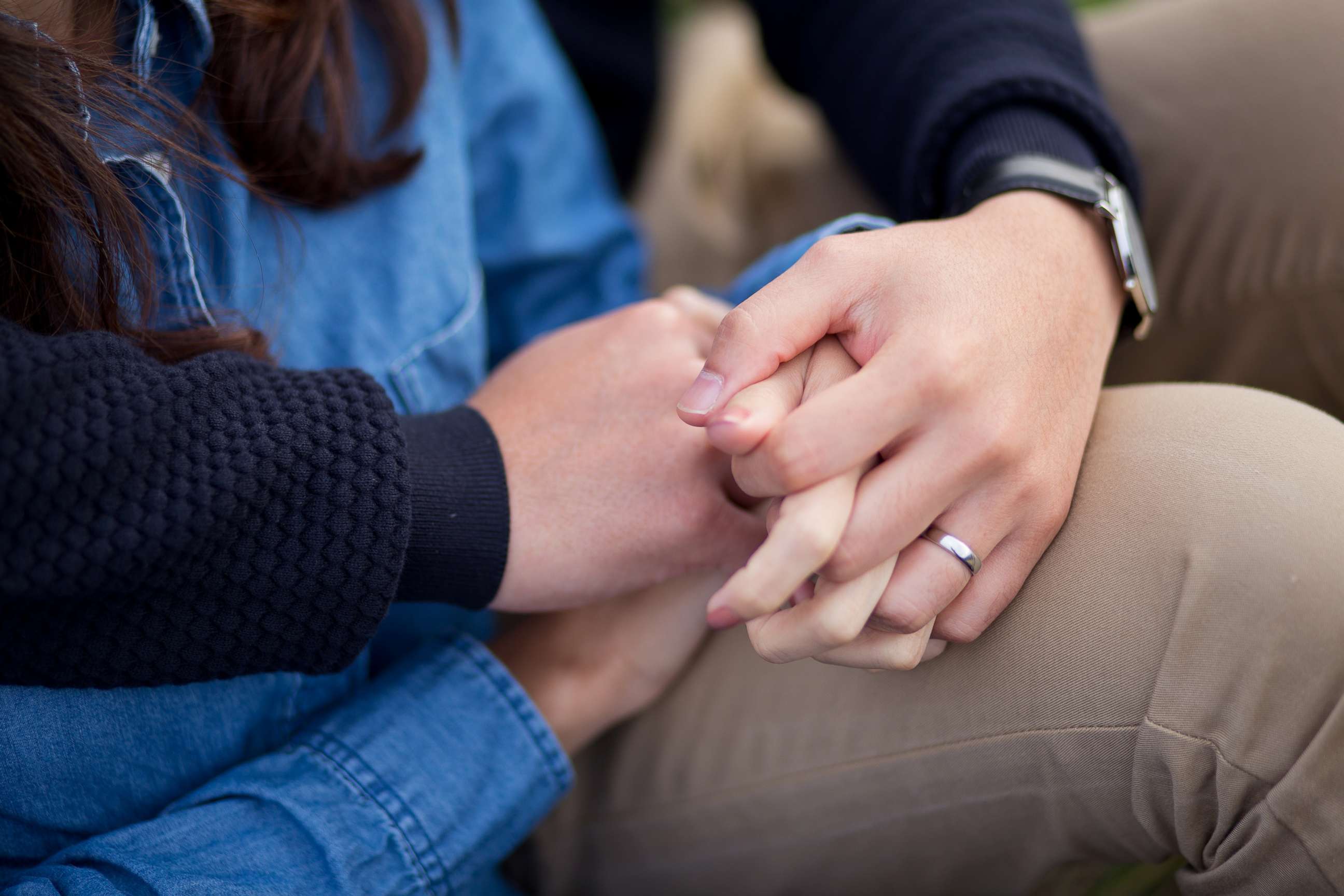 PHOTO: Stock photo of a couple holding hands.